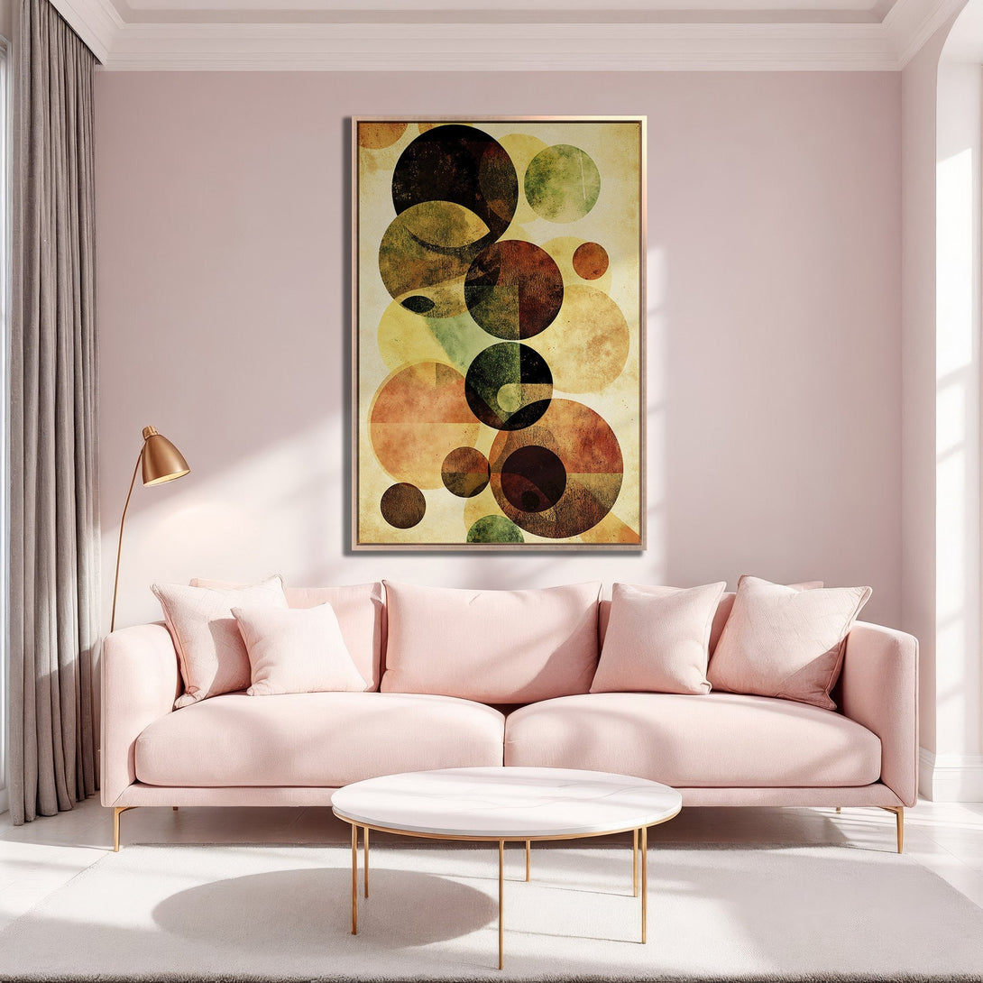 Framed Wall Art featuring abstract geometric circles in warm earth tones, displayed in a stylish interior with a pink sofa. Elevate your space with this modern art.