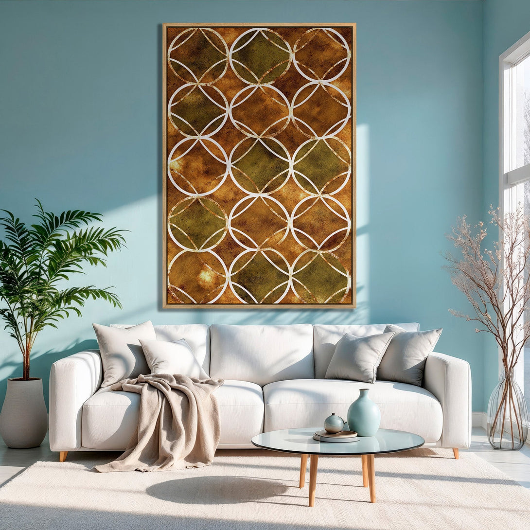 Framed Wall Art featuring a geometric design in warm brown and olive tones, displayed in a stylish living room with a blue wall.