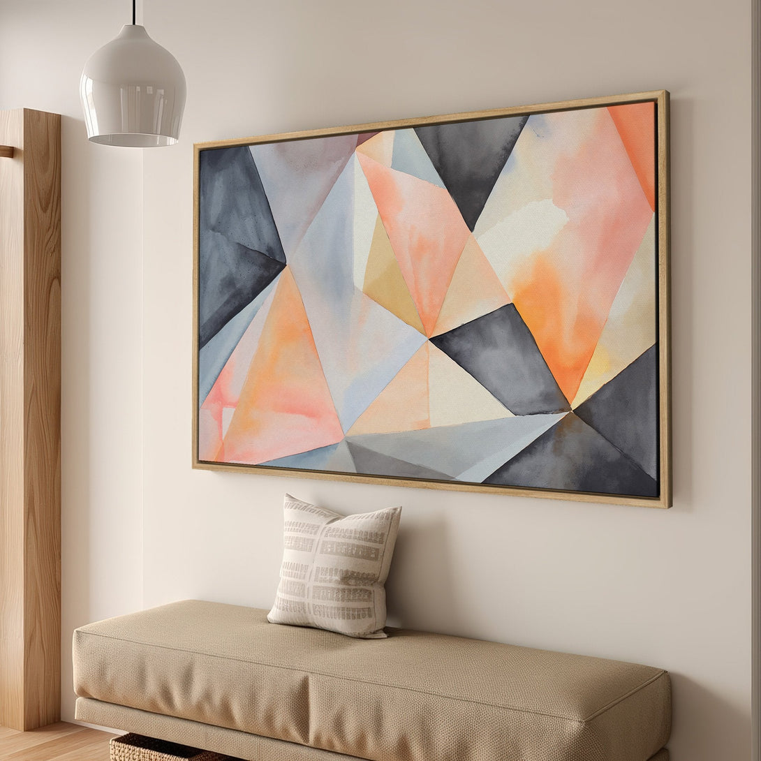 Framed Wall Art featuring an abstract geometric design in a watercolor style with a warm color palette of peach, orange, and grey. Perfect for modern decor.
