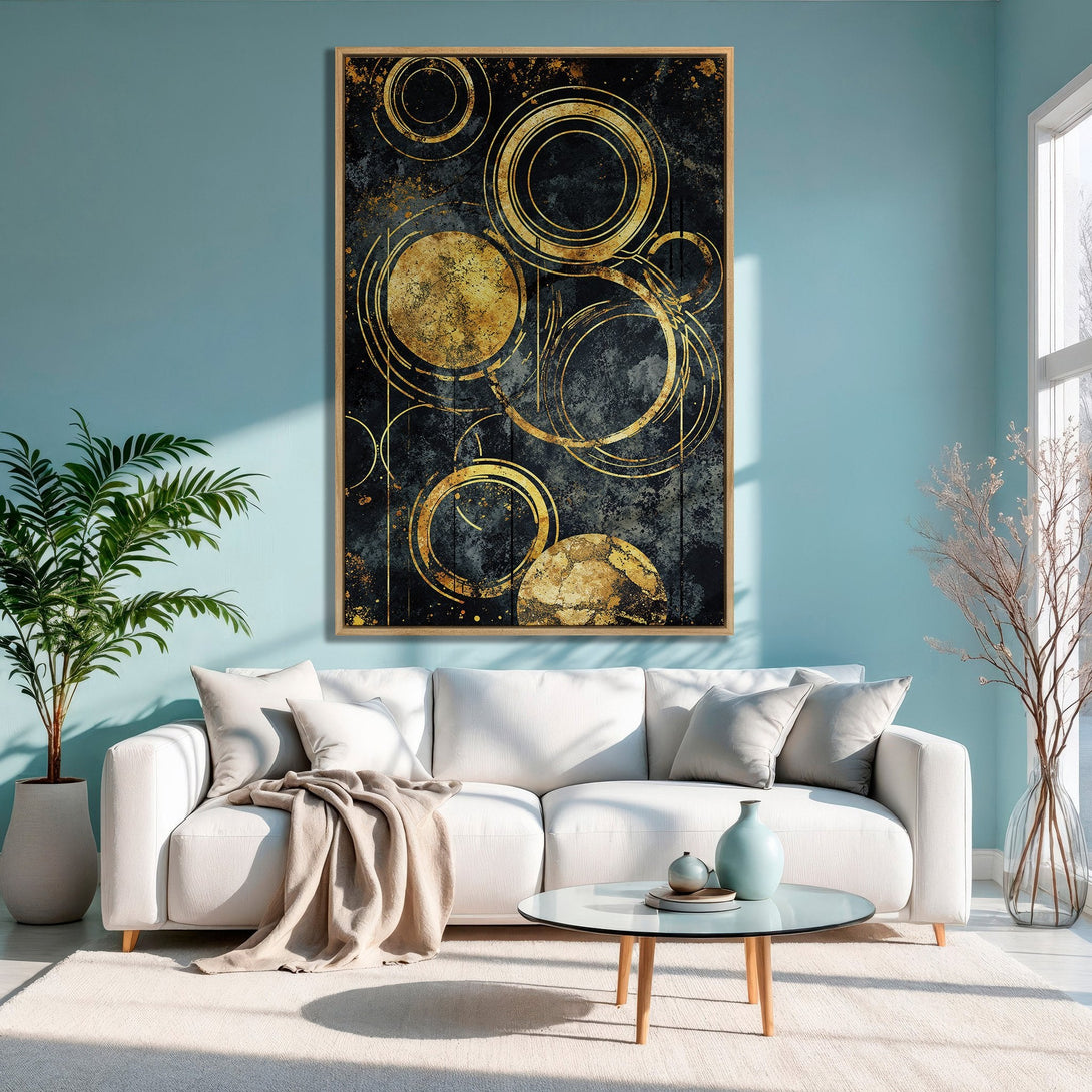Framed Wall Art: Abstract gold circle design on a dark background, adding a touch of elegance to a modern living room with a blue and gold color palette.
