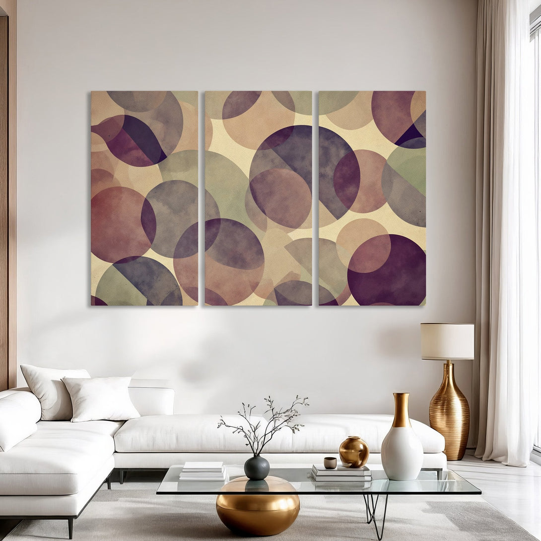 Abstract Canvas Print in a modern interior. Features overlapping circles in a muted purple, beige, and green color palette. Perfect for adding a pop of art!