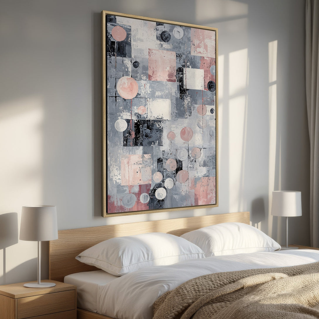 Framed Wall Art: Abstract art in a bedroom. Modern canvas print with pink, gray, and black geometric shapes. Perfect for adding a touch of elegance.