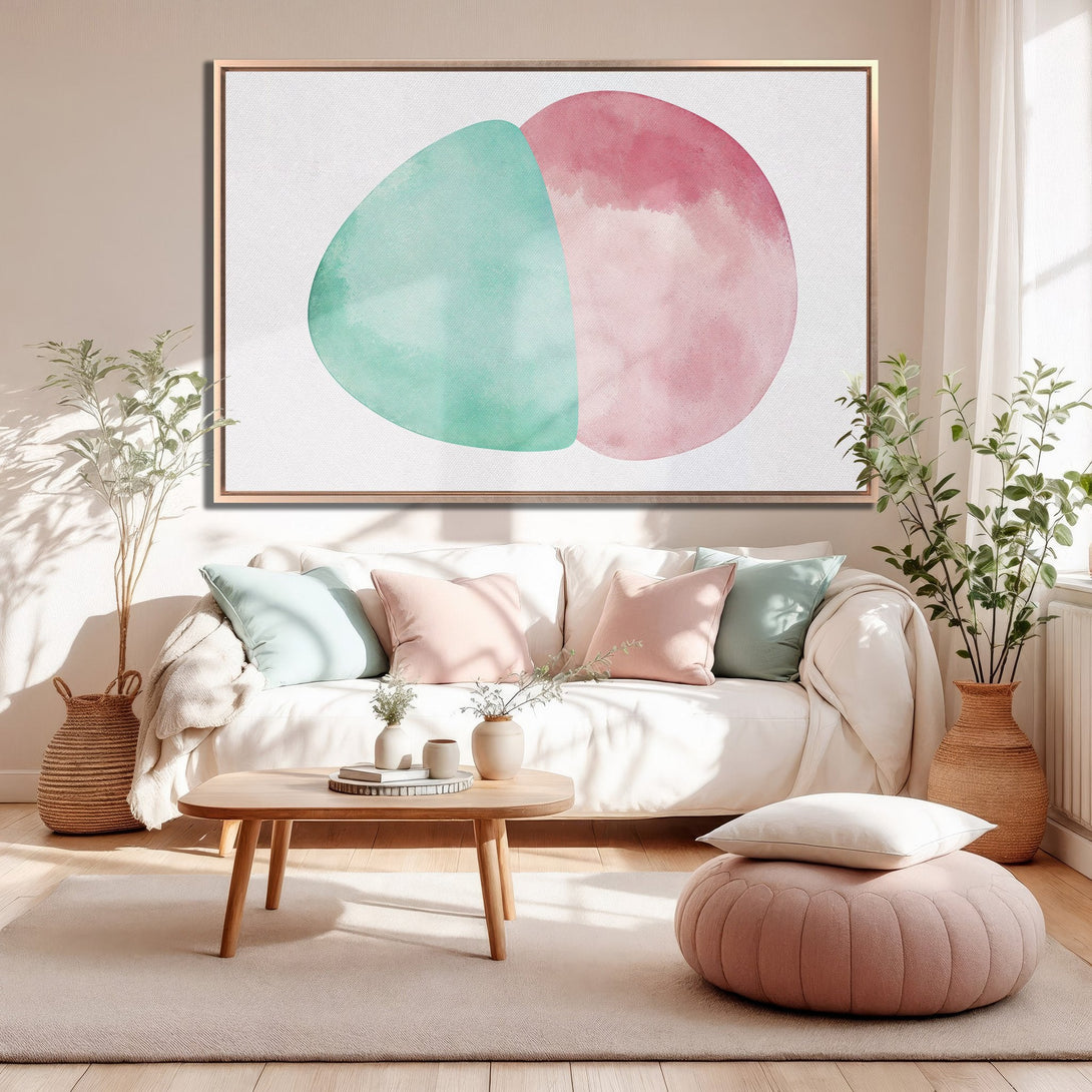 Framed Wall Art featuring abstract watercolor design in soft pink and teal. Modern decor for a calming living room.