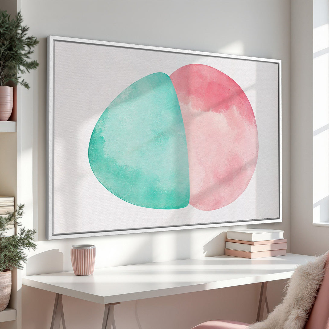 Framed Wall Art featuring abstract watercolor shapes in teal and pink. Modern art canvas print perfect for adding a pop of color to any space.