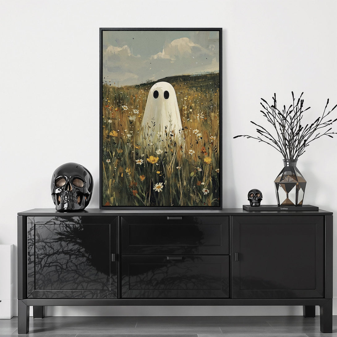 Framed Wall Art featuring a whimsical ghost in a field, painted in a soft, muted color palette. Perfect for adding a touch of spooky charm to your home decor.