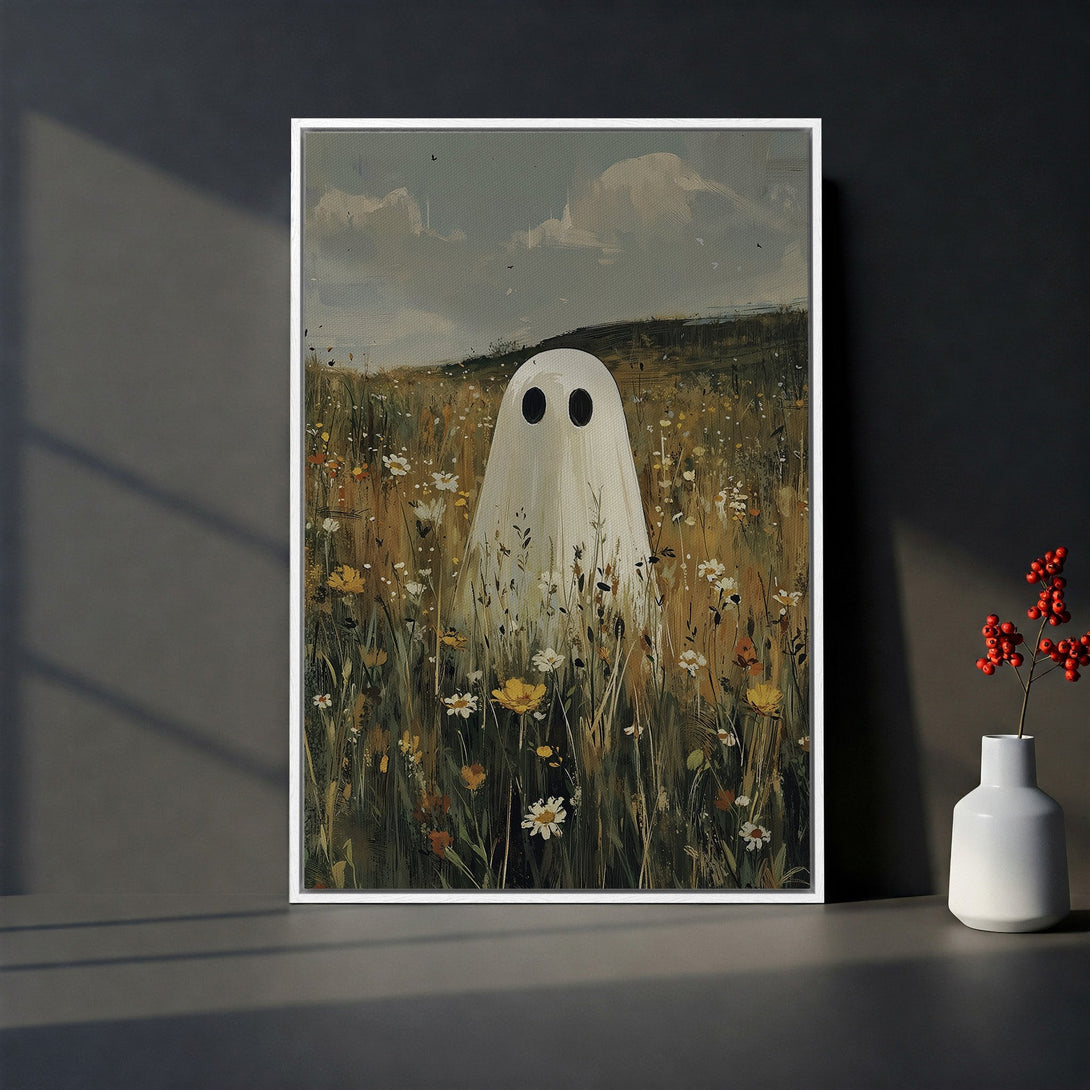 Framed Wall Art featuring a whimsical ghost in a field of flowers. Soft, muted color palette with a painterly style, perfect for adding a touch of spooky charm.