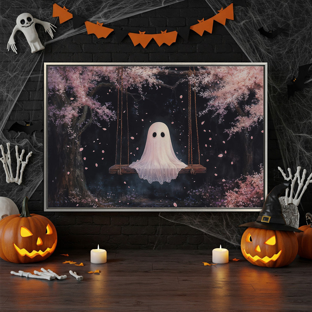 Framed Wall Art: Ghost on a swing in a whimsical style with pink cherry blossoms, set against a dark, moody background. Perfect Halloween decor!