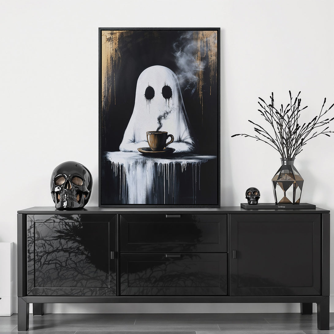 Framed Wall Art featuring a ghost enjoying coffee, in a black and white color palette with gold accents. Modern, spooky decor for your home.