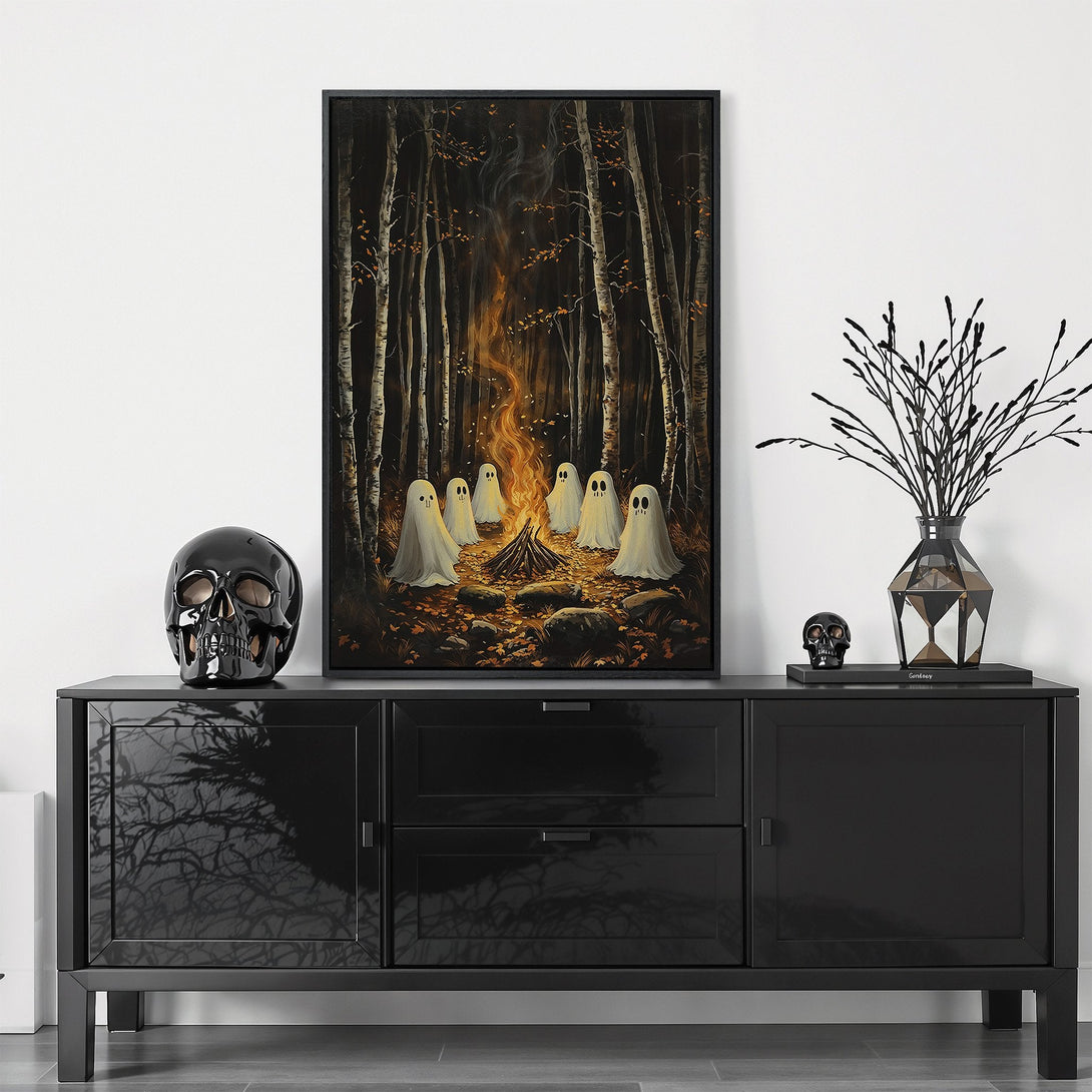 Framed Wall Art featuring ghosts around a campfire in a forest, with a dark, moody color palette. Perfect Halloween decor!