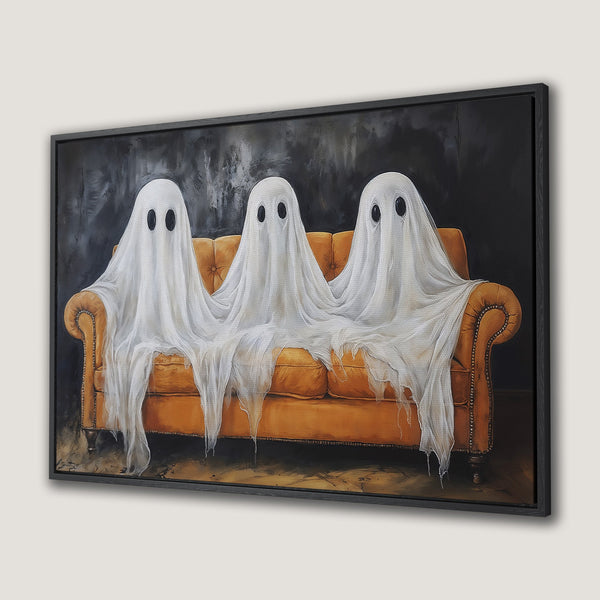 Framed Wall Art: Spooky painting of three ghosts on an orange couch. Modern style with a black, white, and orange color palette. Perfect Halloween decor!