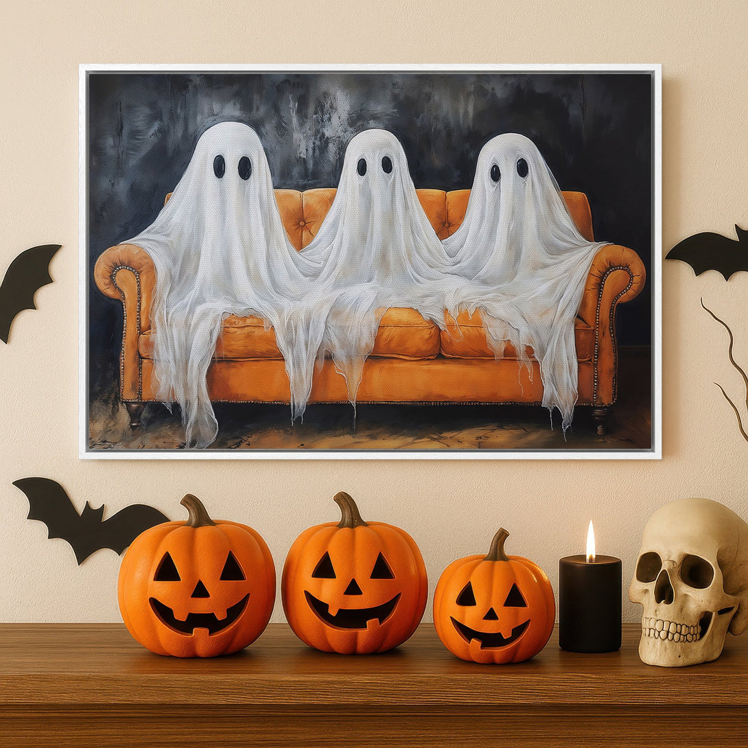 Framed Wall Art: Spooky Halloween Canvas Print featuring ghosts on an orange couch. Perfect for fall decor. Black, white, and orange color palette.