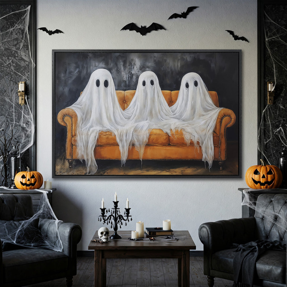 Framed Wall Art: Spooky Halloween canvas print featuring ghosts on a couch, with a dark, moody color palette. Perfect for adding a touch of eerie decor!