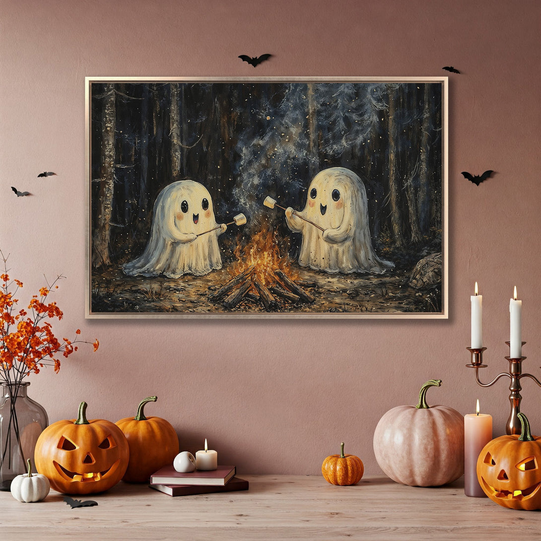 Framed Wall Art featuring adorable ghosts roasting marshmallows in a whimsical, dark forest scene. Warm autumn color palette. Perfect Halloween decor!