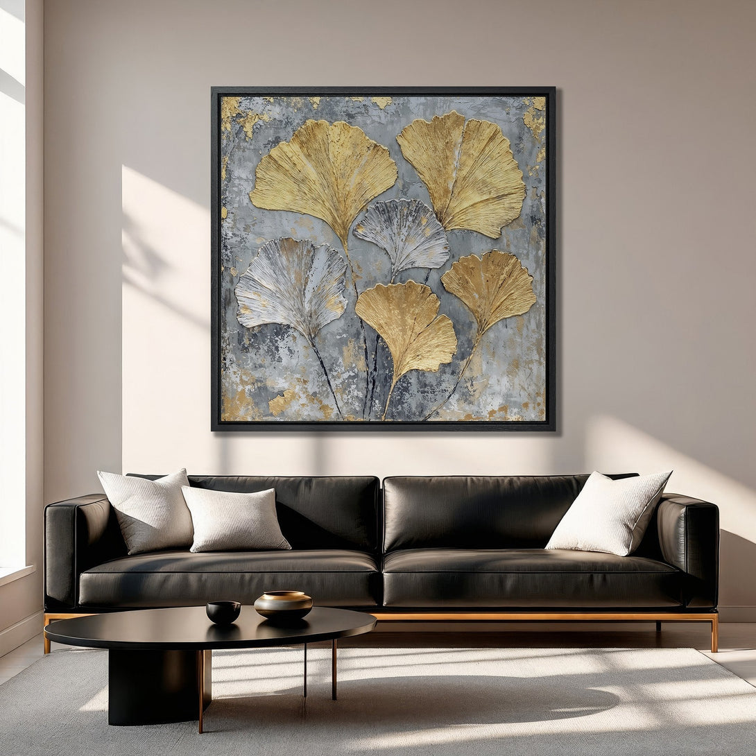 Framed Wall Art featuring gold & silver ginkgo leaves on a textured grey background. Modern, elegant canvas print for living room decor.