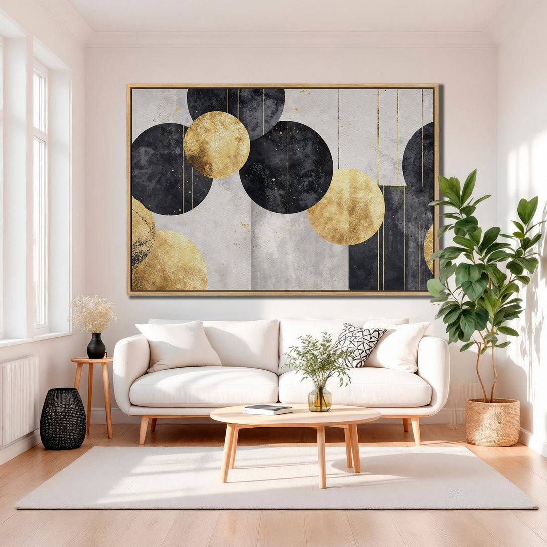 Framed Wall Art featuring abstract gold and black circles. Modern art canvas print in a neutral interior. Perfect for living room decor.