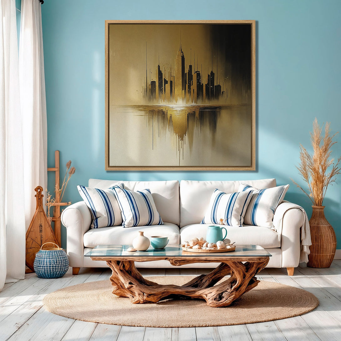 Framed Wall Art: Abstract city skyline in gold and black tones. Modern art canvas print in a coastal-inspired living room with a blue and neutral color palette.