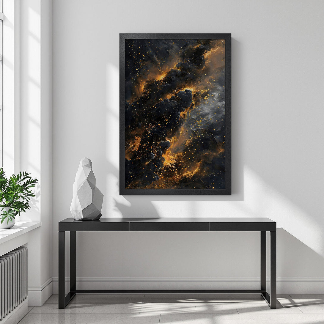 Framed Poster featuring a cosmic nebula art print in black, gold, and gray. Elevate your space with this stunning abstract wall art.