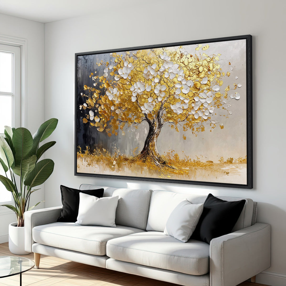 Framed Wall Art: Textured gold tree painting with white and gold accents, displayed in a modern living room. Elegant decor with a neutral color palette.