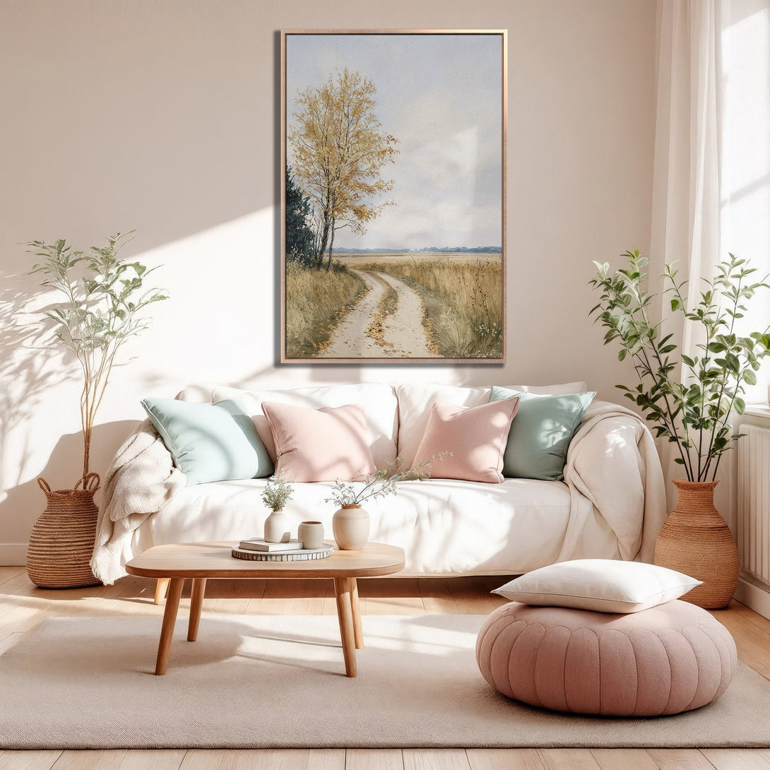 Framed Wall Art: Serene landscape Canvas Print with a neutral color palette, featuring a dirt road and a tree, perfect for a cozy living room.