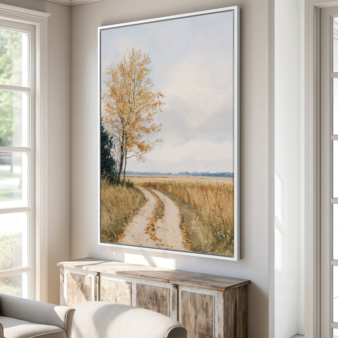 Framed Wall Art: Landscape Canvas Print of a country road with yellow autumn trees. Warm neutral color palette for cozy home decor.