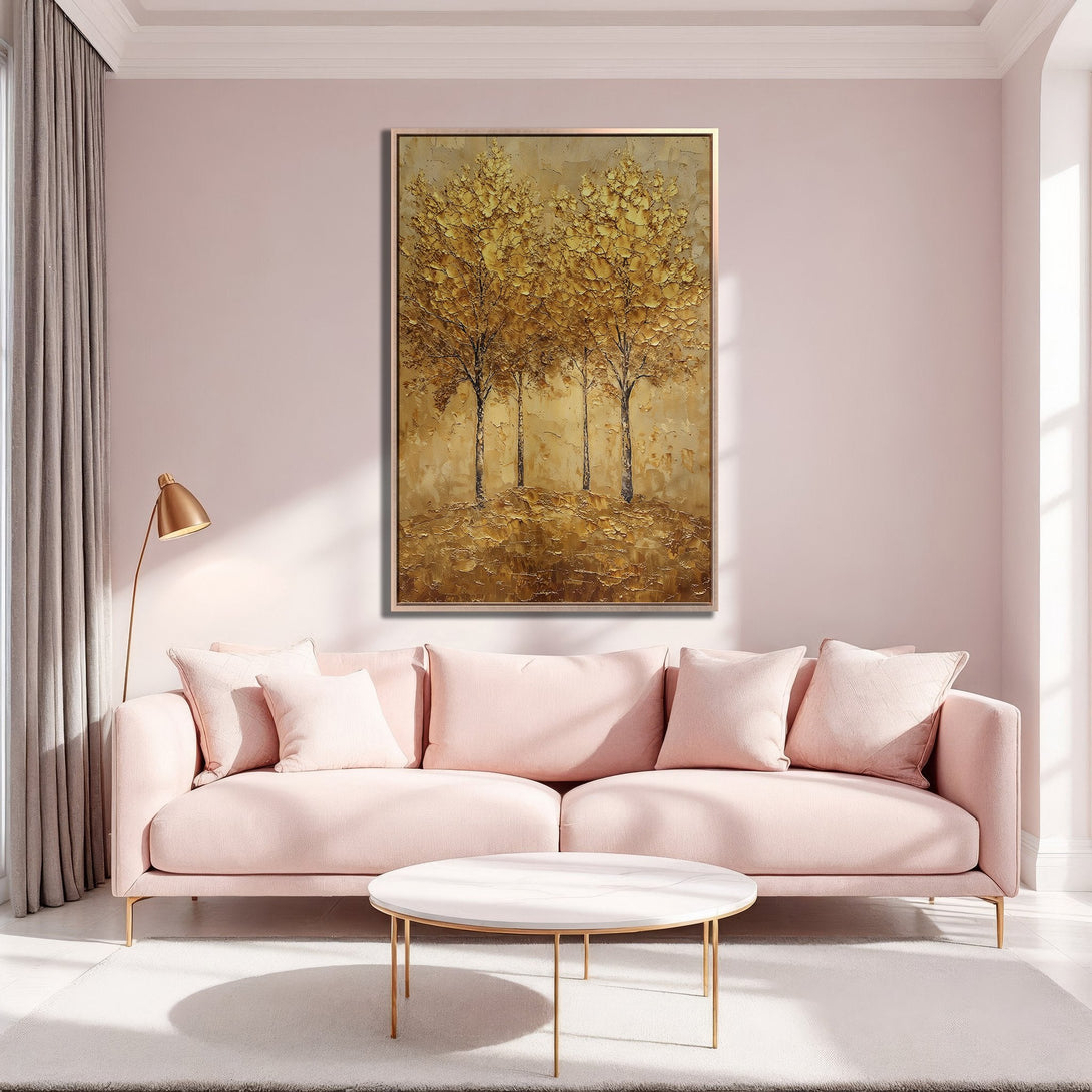 Framed Wall Art of golden trees in a modern living room. Warm, neutral color palette with pink sofa. Perfect for adding elegance to your space.