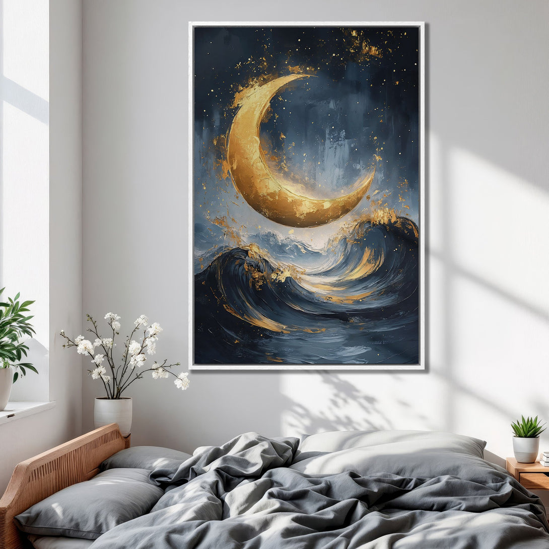 Framed Wall Art: Abstract painting of a golden crescent moon over ocean waves in a bedroom. Features a dark blue and gold color palette.