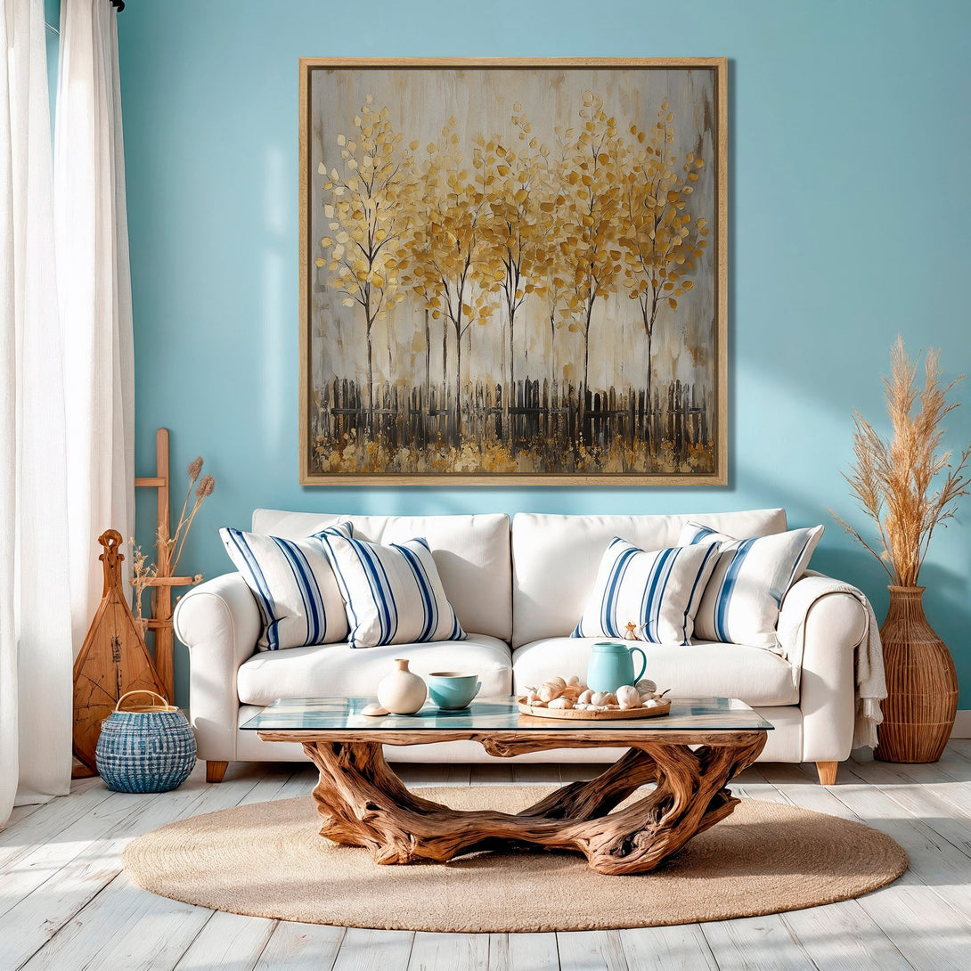 Framed Wall Art featuring abstract golden trees in a living room setting. Warm, neutral color palette with pops of blue. Perfect for modern home decor.