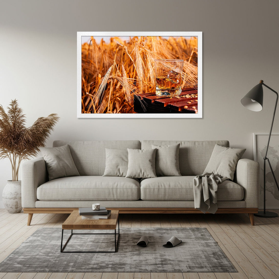 Framed Poster featuring a whiskey glass in a field, warm tones and rustic style. Perfect wall art for your home!