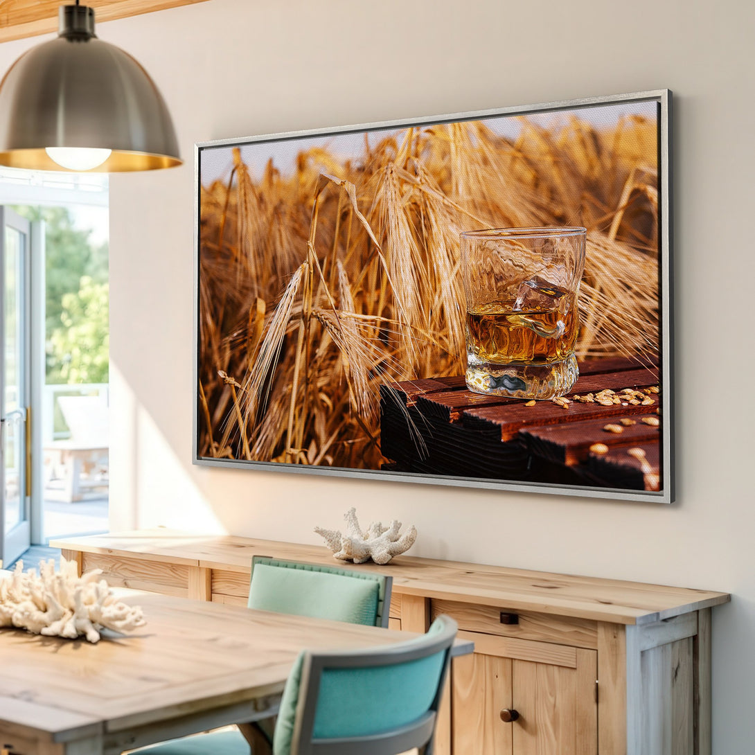 Framed Wall Art featuring a whiskey glass on a wooden surface with a wheat field backdrop. Warm, inviting color palette. Perfect for home decor.