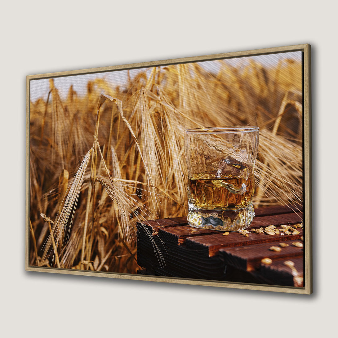 Canvas Print of whiskey on a wooden table with wheat field background. Warm, rustic tones. Perfect framed wall art for a cozy space.