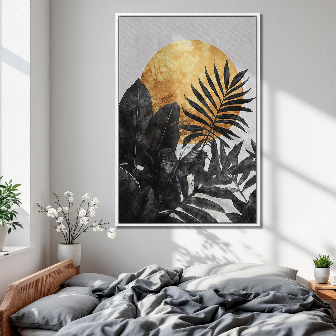 Framed Wall Art featuring a black and gold botanical design. Modern canvas print with a tropical leaf motif, perfect for bedroom decor.