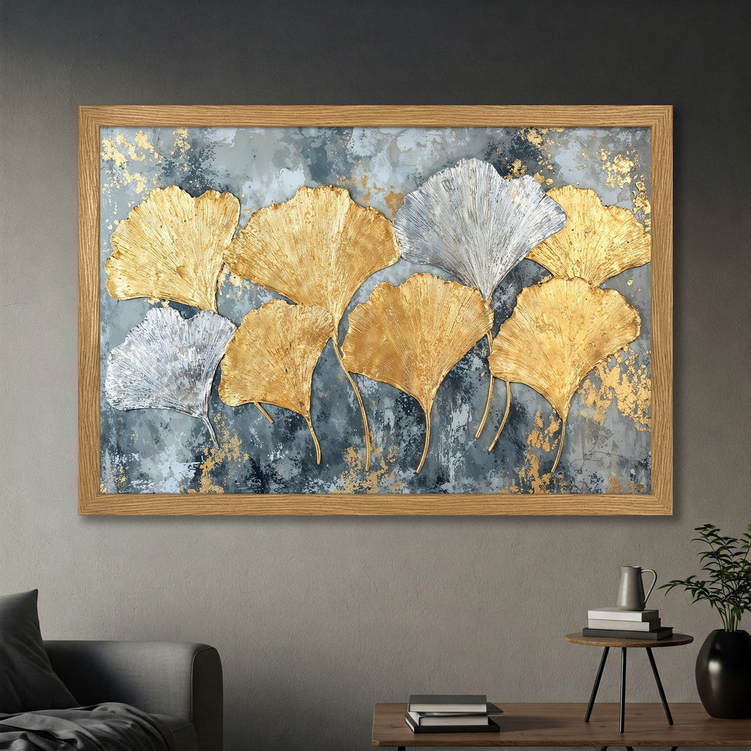 Framed Poster featuring gold and silver ginkgo leaves on a textured grey background. Modern art print with a luxurious feel.