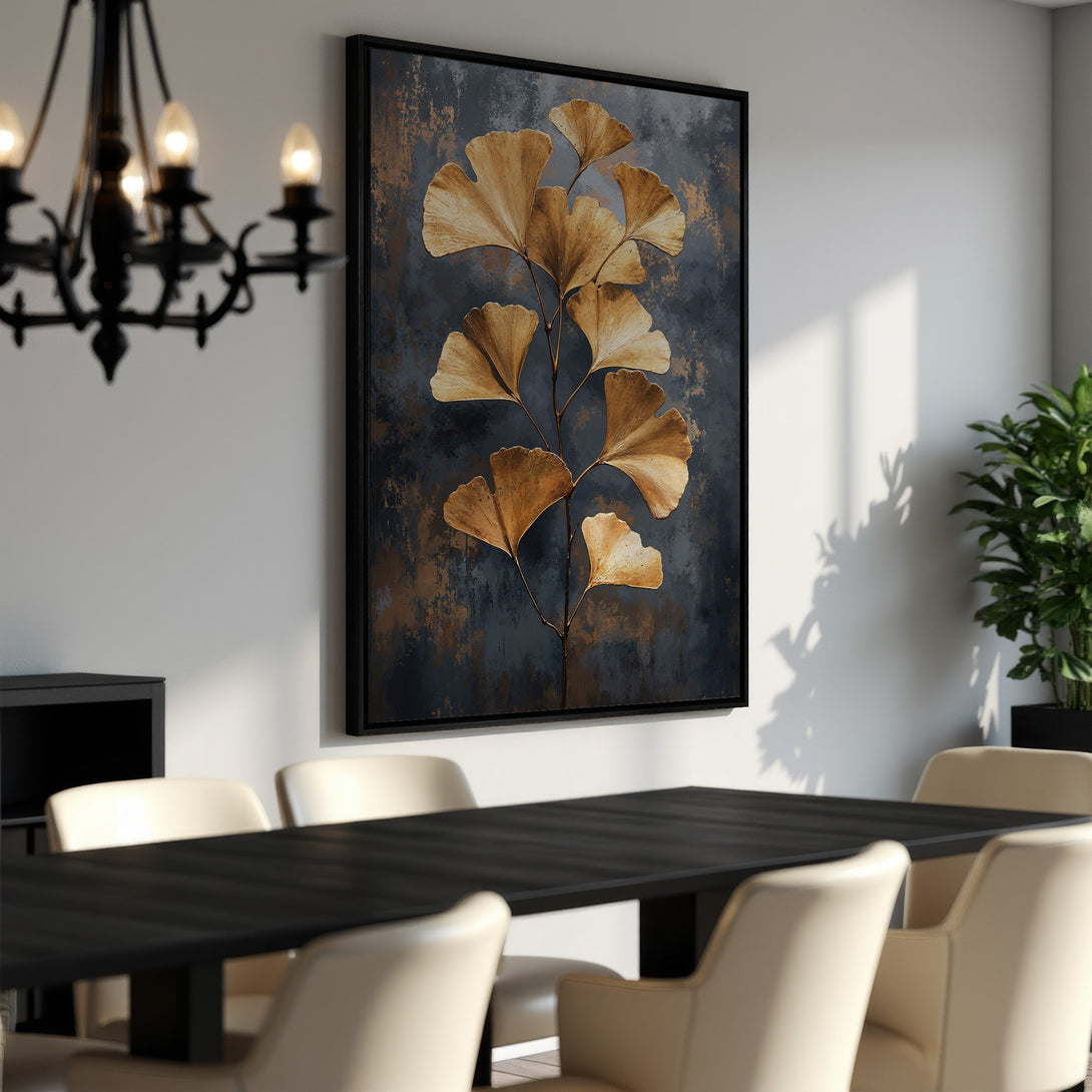 Framed Wall Art featuring gold ginkgo leaves on a dark, textured background. Modern, elegant decor in a dining room setting. Warm color palette.