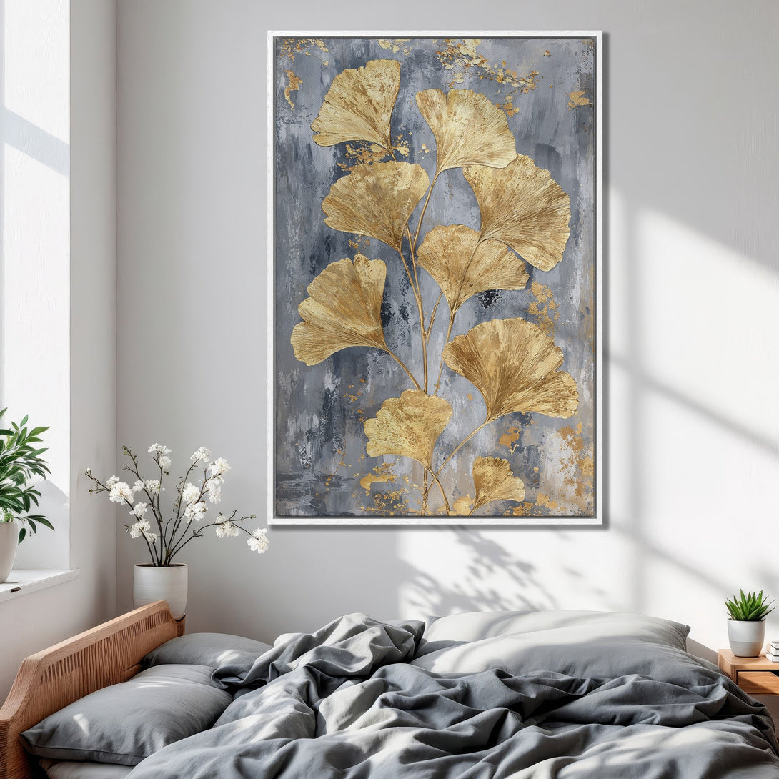 Framed Wall Art: Gold ginkgo leaves on a gray & gold abstract canvas print. Modern botanical art for bedroom decor.