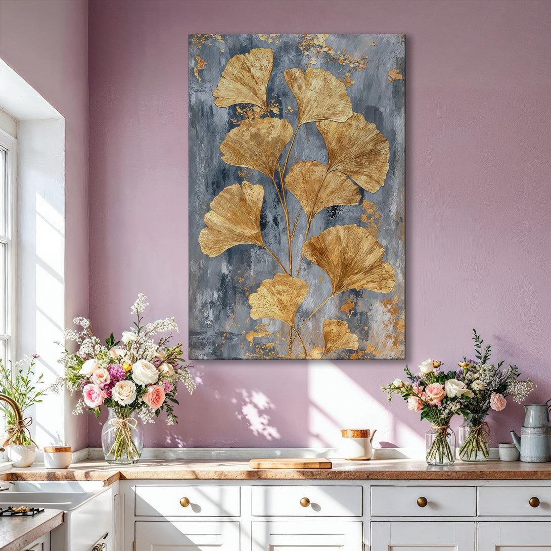 Framed Wall Art: Gold ginkgo leaf painting on a gray background, displayed in a modern living room. Elegant abstract art with metallic gold accents.