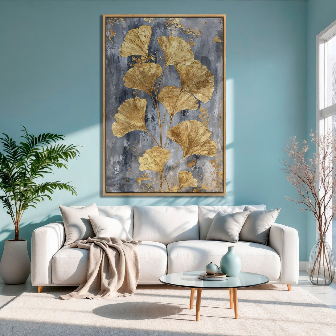 Framed Wall Art: Gold leaf ginkgo canvas print in a modern living room. Features a gray and gold color palette, adding elegance to any space.