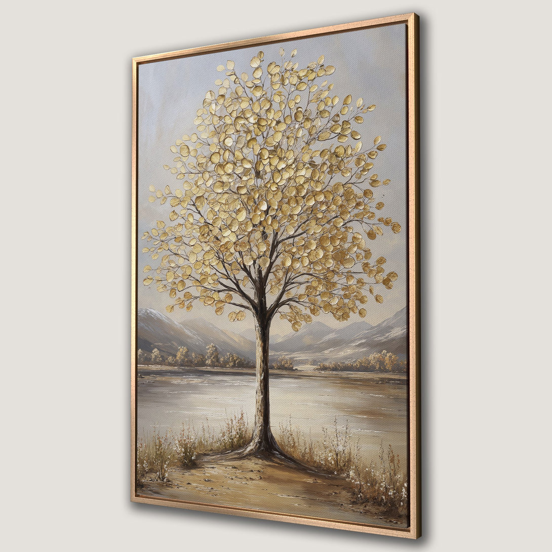 Framed Wall Art of a golden-leafed tree by a lake. Neutral color palette with gold and beige tones. Perfect for adding a touch of nature to your home.