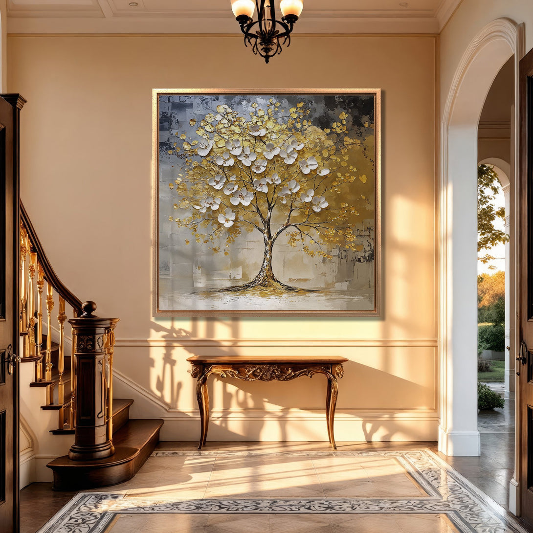 Framed Wall Art featuring a textured tree with white blossoms and gold leaves. Neutral color palette, displayed in a luxury interior setting.