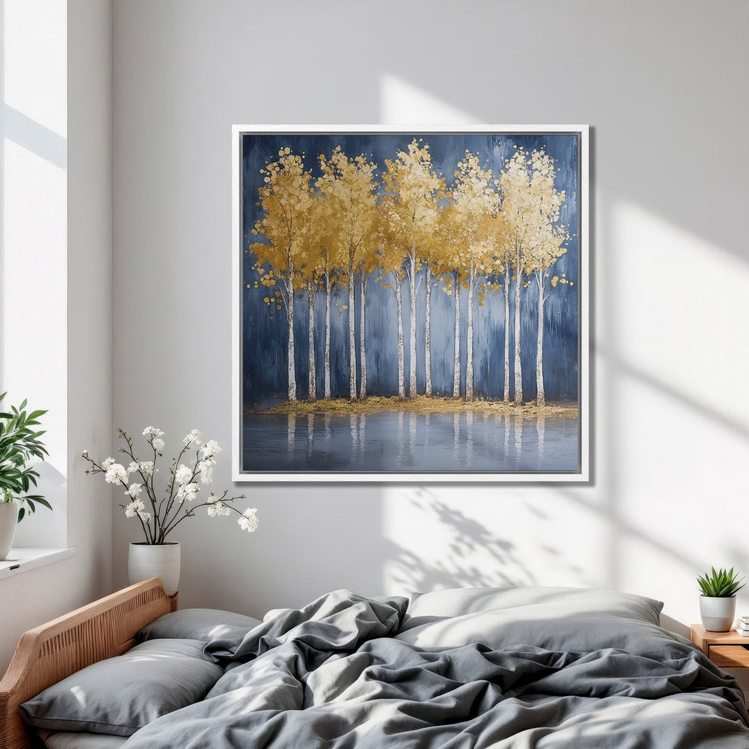 Framed Wall Art featuring gold trees against a navy blue background. Modern abstract landscape Canvas Print with a calming, neutral color palette.