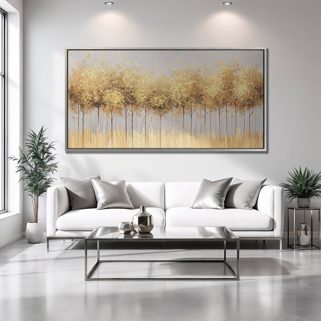 Framed Wall Art: Abstract gold trees painting in a modern living room. Warm gold and gray tones create a sophisticated and inviting atmosphere.