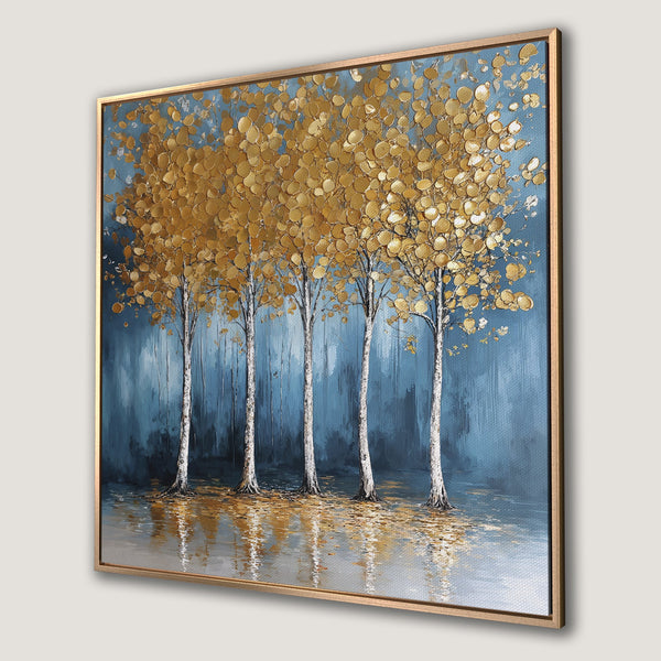 Framed Wall Art: Abstract gold leaf trees against a blue backdrop. Modern canvas print with a calming color palette.