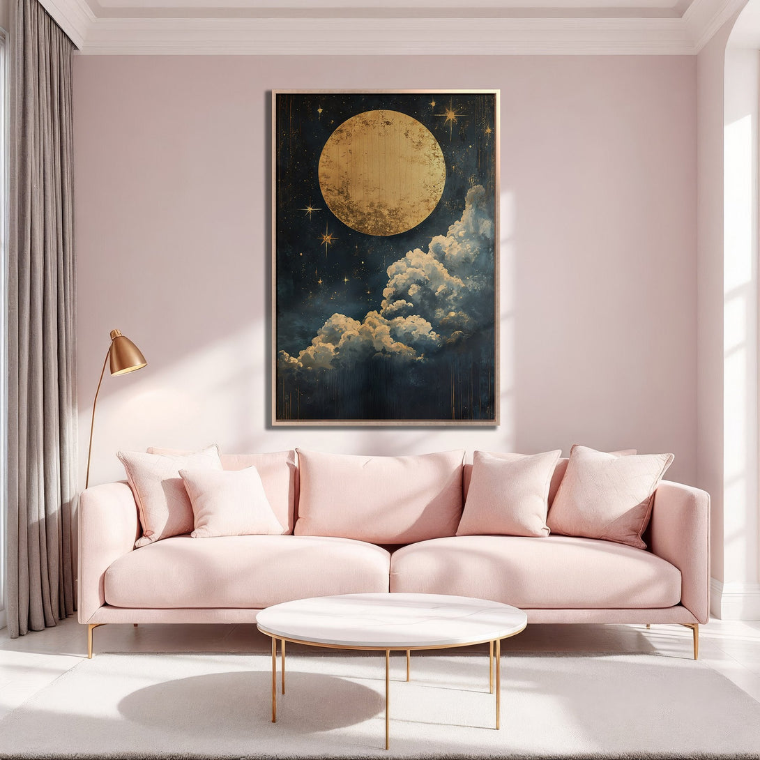 Framed Wall Art featuring a celestial moon and cloudscape in gold and navy tones, displayed in a blush pink interior. Perfect for adding a touch of elegance.