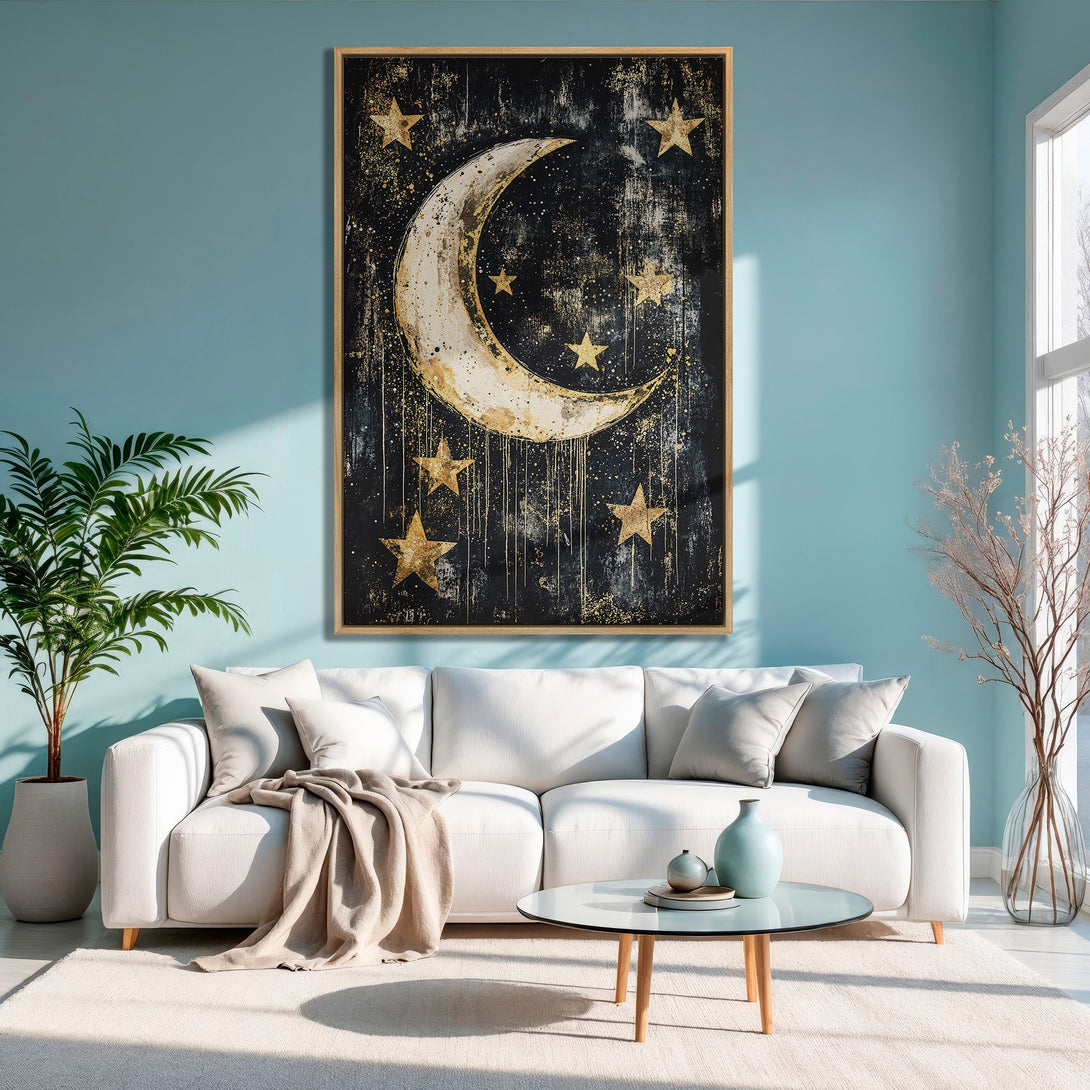 Framed Wall Art featuring a celestial moon and stars in gold on a black background. Modern art with a neutral, yet striking color palette.