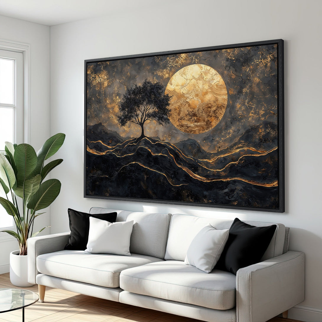 Framed Wall Art featuring an abstract landscape with a tree, moon, and gold accents. Modern art in a black, gold, and gray color palette. Enhance your space!