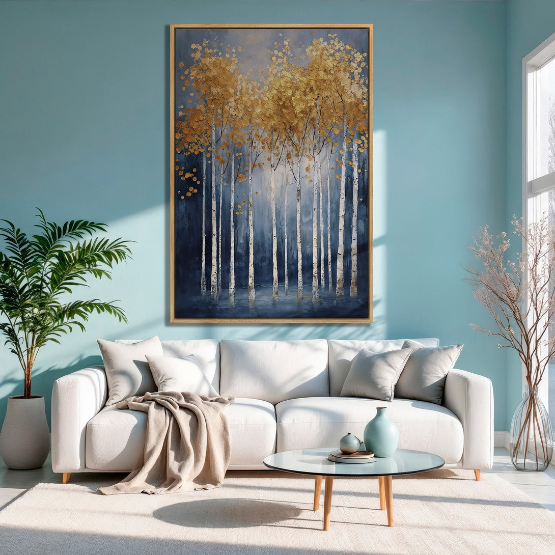 Framed Wall Art: Abstract gold leaf trees on canvas, displayed in a modern living room with blue and neutral color palette. Elevate your space!