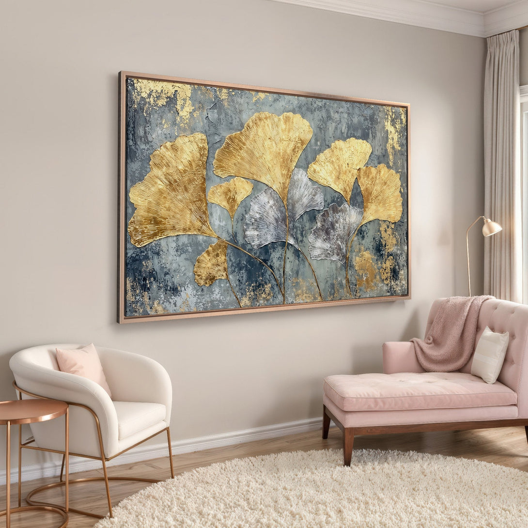 Framed Wall Art featuring gold and silver ginkgo leaves on a textured teal background. Modern art with a warm, inviting color palette.