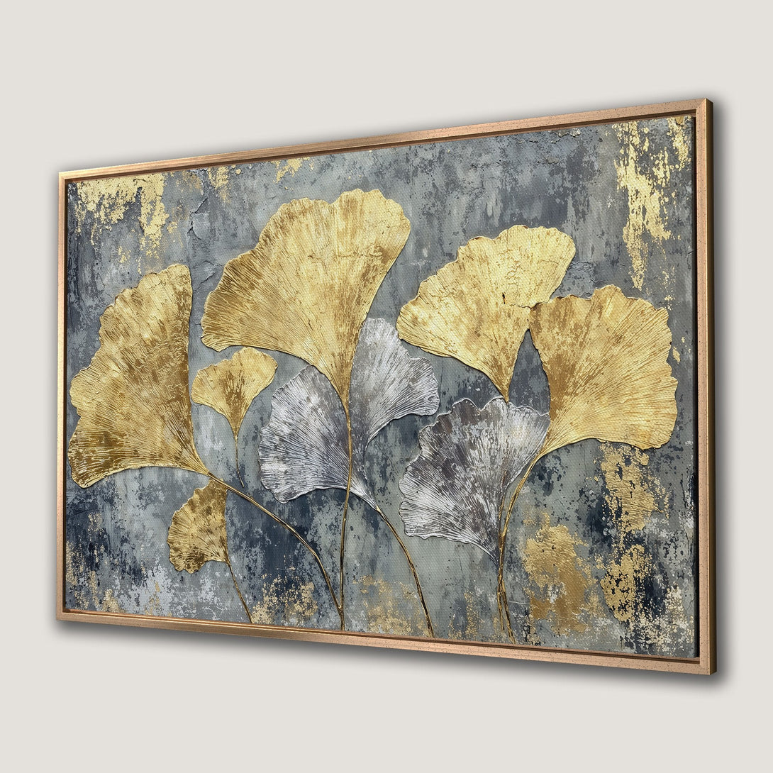 Framed Wall Art featuring gold and silver ginkgo leaves on a textured gray background. Modern abstract art for stylish home decor.