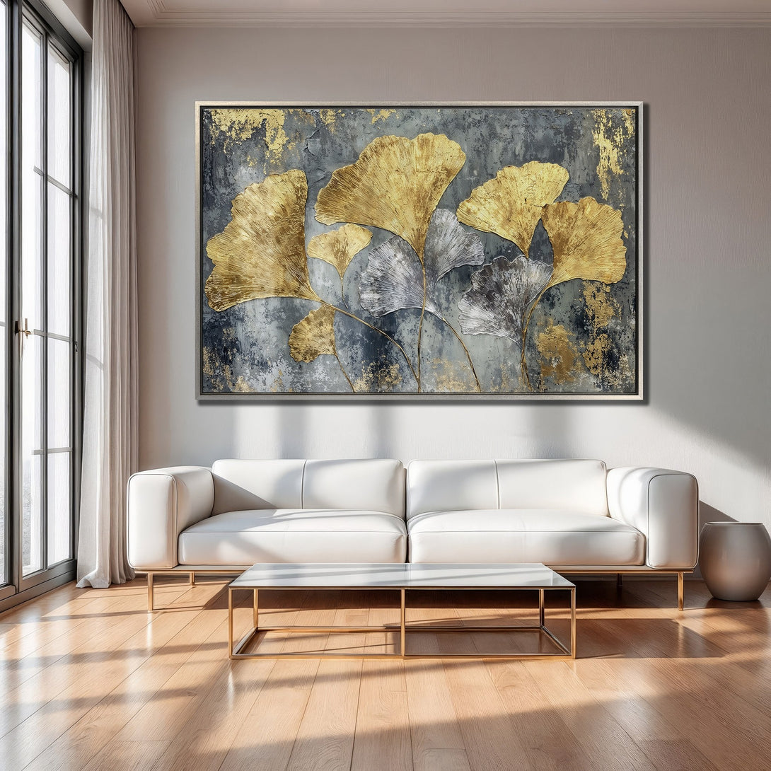 Framed Wall Art: Abstract gold leaf ginkgo canvas print in a modern living room. Features a gray, gold, and white color palette.