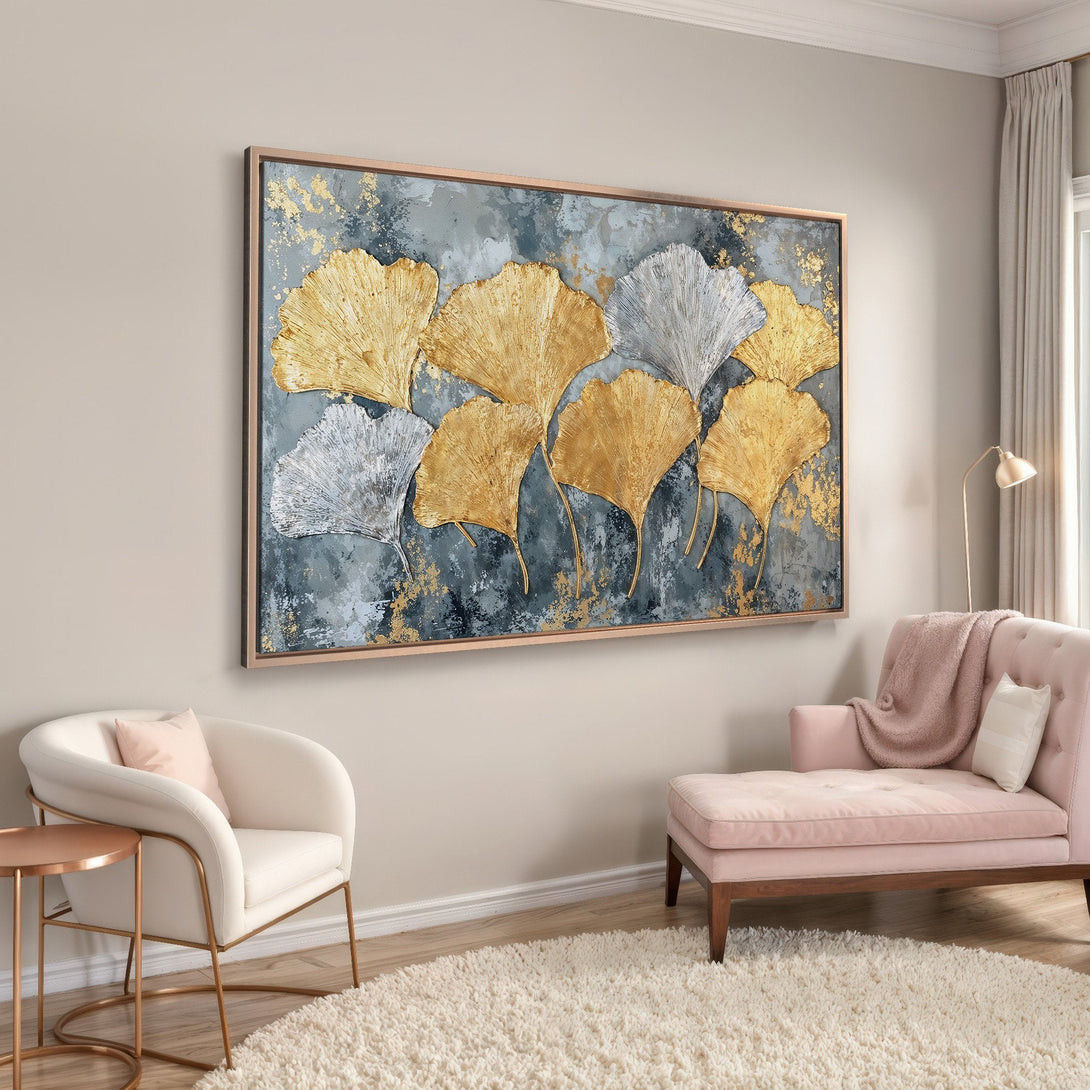 Framed Wall Art featuring gold and silver ginkgo leaves on a textured blue-gray background. Modern abstract art with a touch of luxury.