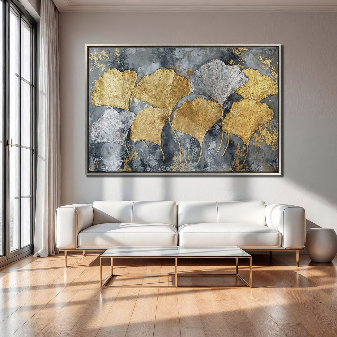 Framed Wall Art featuring gold and silver ginkgo leaves on a textured gray background. Modern abstract art with a luxurious color palette.